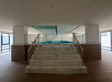 Двухкомнатные апартаменты, 55м², с чистовой отделкой в резиденции премиум класса в Махмутларе, Алания ID-19221 фото-23