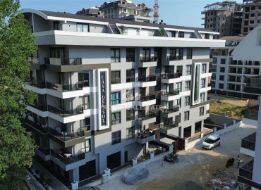 Двухкомнатные апартаменты, 55м², с чистовой отделкой в резиденции премиум класса в Махмутларе, Алания ID-19221 фото-26