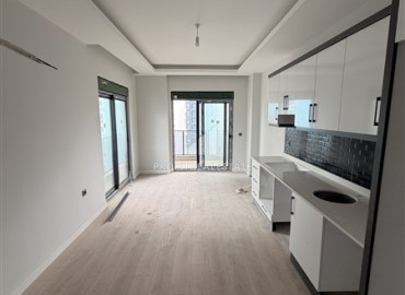 Двухкомнатная квартира, 55м², в резиденции с хорошей инфраструктурой в 500м от моря в Махмутларе, Алания ID-19225 фото-4