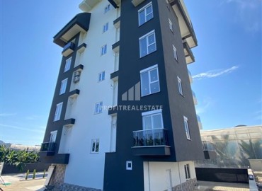 Квартира с одной спальней, 55м², в новом комплексе с бассейном в 500м от моря в Каргыджаке, Алания ID-19229 фото-12