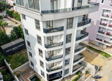 Двухкомнатные апартаменты, 50м² в новом комплексе с бассейном в 200м от моря в центре Алании с возможностью ВНЖ ID-19230 фото-1