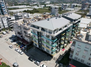 Укомплектованная квартира 2+1, 90м² с видом на горы в комфортабельном комплексе в Махмутларе, Алания ID-19231 фото-1