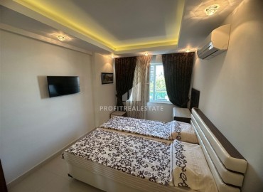 Уютная двухкомнатная квартира, 55м², с видом на горы в комфортабельном комплексе в 200м от моря в Махмутларе, Алания ID-19242 фото-17