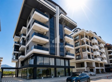Видовые двухкомнатные апартаменты, 51м², с оригинальным интерьером, в 150м от моря в районе Каргыджак, Алания ID-19248 фото-1