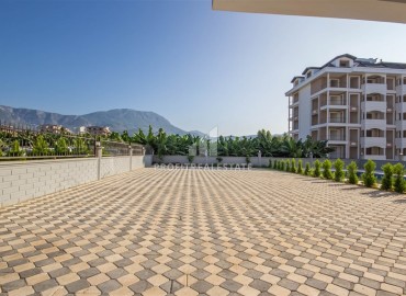 Видовые двухкомнатные апартаменты, 51м², с оригинальным интерьером, в 150м от моря в районе Каргыджак, Алания ID-19248 фото-20