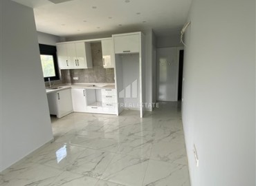 Квартира с одной спальней, 60м², с чистовой отделкой в комфортабельной новостройке в районе Тосмур, Алания ID-19249 фото-2