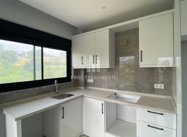 Квартира с одной спальней, 60м², с чистовой отделкой в комфортабельной новостройке в районе Тосмур, Алания ID-19249 фото-5