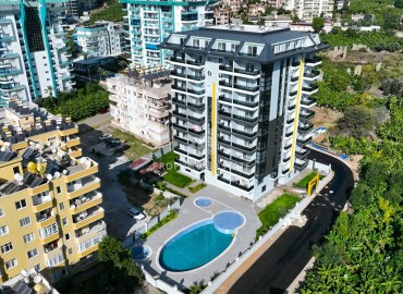 Элегантная двухкомнатная квартира, 50м², в комфортабельной резиденции не далеко от моря в Махмутларе, Алания ID-19261 фото-1