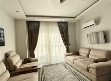 Элегантная двухкомнатная квартира, 50м², в комфортабельной резиденции не далеко от моря в Махмутларе, Алания ID-19261 фото-2