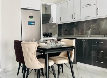 Элегантная двухкомнатная квартира, 50м², в комфортабельной резиденции не далеко от моря в Махмутларе, Алания ID-19261 фото-5