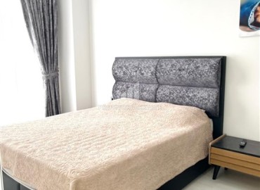 Элегантная двухкомнатная квартира, 50м², в комфортабельной резиденции не далеко от моря в Махмутларе, Алания ID-19261 фото-8