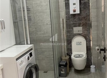 Элегантная двухкомнатная квартира, 50м², в комфортабельной резиденции не далеко от моря в Махмутларе, Алания ID-19261 фото-9