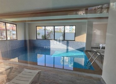 Элегантная двухкомнатная квартира, 50м², в комфортабельной резиденции не далеко от моря в Махмутларе, Алания ID-19261 фото-17