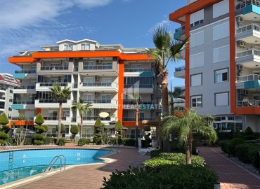 Готовая к проживанию, двухкомнатная квартира, 60м², в элитном комплексе в 200м от моря в районе Кестель, Алания ID-19262 фото-1