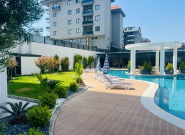 Апартаменты 1+1, 54м², с дизайнерским интерьером в премиум-комплексе в 100м от моря в районе Каргыджак, Алания ID-19266 фото-23