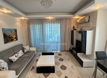 Симпатичная двухкомнатная квартира, 70м², с видом на горы в 200м от моря в Махмутларе, Алания ID-19088 фото-1