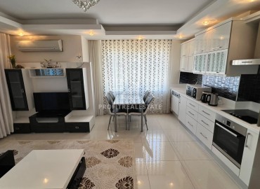 Симпатичная двухкомнатная квартира, 70м², с видом на горы в 200м от моря в Махмутларе, Алания ID-19088 фото-3