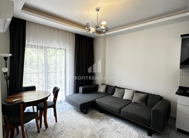 Квартира с одной спальней, 50м², с симпатичным интерьером в комплексе с хорошей инфраструктурой в Махмутларе, Алания ID-19294 фото-2
