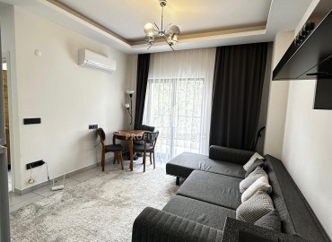 Квартира с одной спальней, 50м², с симпатичным интерьером в комплексе с хорошей инфраструктурой в Махмутларе, Алания ID-19294 фото-3