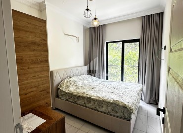 Квартира с одной спальней, 50м², с симпатичным интерьером в комплексе с хорошей инфраструктурой в Махмутларе, Алания ID-19294 фото-10