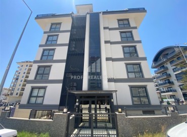 Апартаменты с одной спальней, 55м², в новостройке с хорошей инфраструктурой в 600м от моря в Махмутларе, Алания ID-19315 фото-1