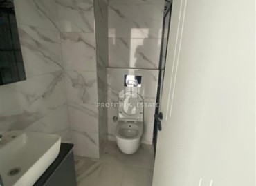 Апартаменты с одной спальней, 55м², в новостройке с хорошей инфраструктурой в 600м от моря в Махмутларе, Алания ID-19315 фото-5
