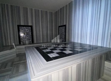Апартаменты с одной спальней, 55м², в новостройке с хорошей инфраструктурой в 600м от моря в Махмутларе, Алания ID-19315 фото-12