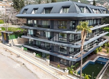 Фешенебельная трехкомнатная квартира, 90м², с выходом в сад в новой элитной резиденции в центре Алании, в районе Хасбахче ID-19325 фото-1