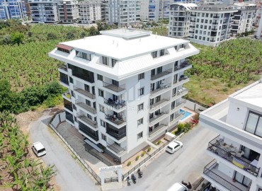 Двухкомнатная квартира, 52м², в комфортабельном комплексе с зимним бассейном в Махмутларе, Алания ID-19329 фото-1