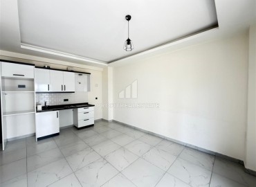 Двухкомнатная квартира, 52м², в комфортабельном комплексе с зимним бассейном в Махмутларе, Алания ID-19329 фото-2