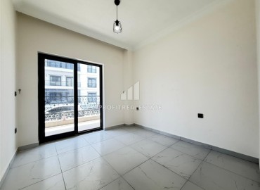 Двухкомнатная квартира, 52м², в комфортабельном комплексе с зимним бассейном в Махмутларе, Алания ID-19329 фото-4