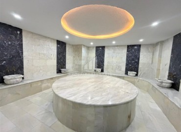Двухкомнатная квартира, 52м², в комфортабельном комплексе с зимним бассейном в Махмутларе, Алания ID-19329 фото-9