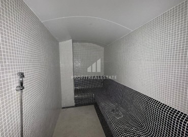 Двухкомнатная квартира, 52м², в комфортабельном комплексе с зимним бассейном в Махмутларе, Алания ID-19329 фото-10