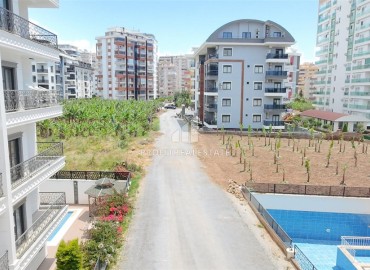 Двухкомнатная квартира, 52м², в комфортабельном комплексе с зимним бассейном в Махмутларе, Алания ID-19329 фото-21