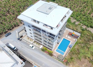 Двухкомнатная квартира, 52м², в комфортабельном комплексе с зимним бассейном в Махмутларе, Алания ID-19329 фото-22