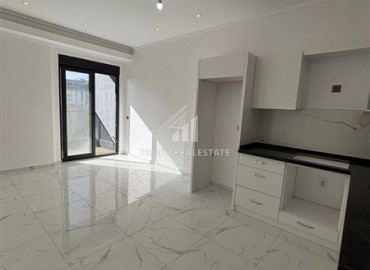 Новые двухкомнатные апартаменты, 55м², в комфортабельном комплексе в районе Махмутлар, Алания, по привлекательной цене ID-19332 фото-2