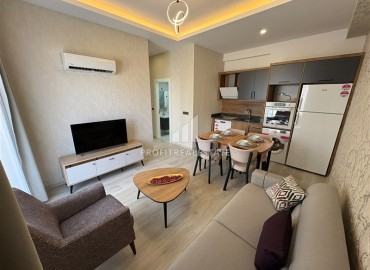 Уютная двухкомнатная квартира, 55м², в новостройке с хорошей инфраструктурой в Махмутларе, Алания ID-19335 фото-3