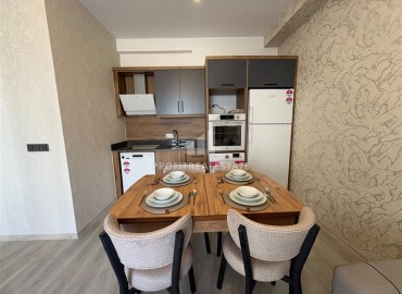 Уютная двухкомнатная квартира, 55м², в новостройке с хорошей инфраструктурой в Махмутларе, Алания ID-19335 фото-5
