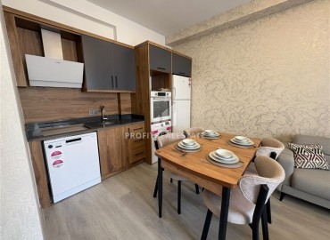 Уютная двухкомнатная квартира, 55м², в новостройке с хорошей инфраструктурой в Махмутларе, Алания ID-19335 фото-6