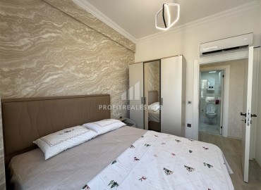 Уютная двухкомнатная квартира, 55м², в новостройке с хорошей инфраструктурой в Махмутларе, Алания ID-19335 фото-9