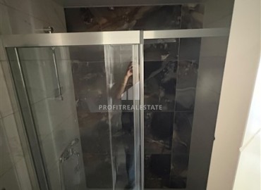 Уютная двухкомнатная квартира, 55м², в новостройке с хорошей инфраструктурой в Махмутларе, Алания ID-19335 фото-11
