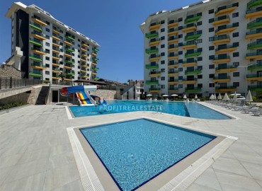 Новые двухкомнатные апартаменты, 55м² в комплексе премиум-класса от ведущего застройщика, в Авсалларе, Алания ID-19344 фото-1