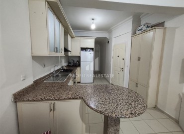 Двухкомнатная квартира, 70м², в комплексе с бассейном на первой линии в центре района Тосмур, Алания ID-19356 фото-13