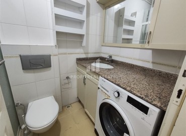 Двухкомнатная квартира, 70м², в комплексе с бассейном на первой линии в центре района Тосмур, Алания ID-19356 фото-16