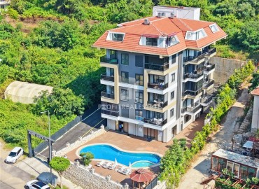 Апартаменты с одной спальней, 50м², в современном комплексе, у горной реки в 750м от моря в районе Кестель, Алания ID-19362 фото-11