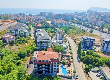 Апартаменты с одной спальней, 50м², в современном комплексе, у горной реки в 750м от моря в районе Кестель, Алания ID-19362 фото-12