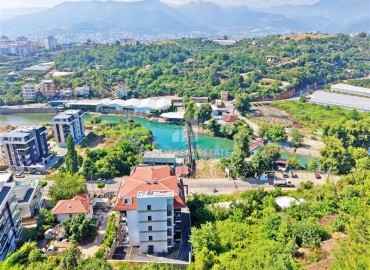 Апартаменты с одной спальней, 50м², в современном комплексе, у горной реки в 750м от моря в районе Кестель, Алания ID-19362 фото-20