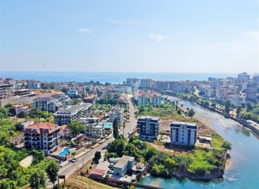 Апартаменты с одной спальней, 50м², в современном комплексе, у горной реки в 750м от моря в районе Кестель, Алания ID-19362 фото-24