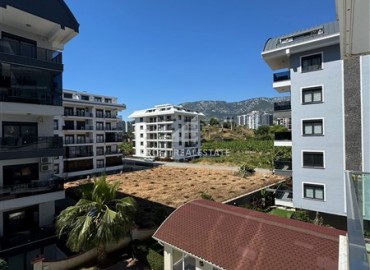 Стильная квартира с одной спальней, 70м², в комплексе с хорошей инфраструктурой, у моря в Махмутларе, Алания ID-19374 фото-12