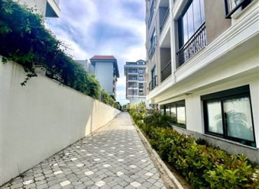 Квартира с двумя спальнями, 100м², без мебели в комплексе премиум класса в 200м от моря в районе Каргыджак, Алания ID-19377 фото-11